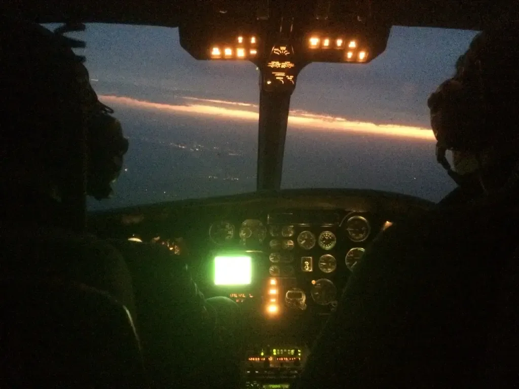 Sunset through the windscreen on a helicopter night rating flight